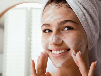 teenager washing her face