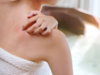 woman itching her back
