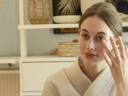 woman applying eye cream