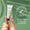 En hand håller en tub med Green People Firming Vitamin C Eye Serum 10ml mot en grön bakgrund med ett märke för dermatologiskt testad.