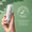 En hand håller en flaska Green People Scent Free Face & Neck Serum mot en grön bakgrund med en Dermatologically Tested-logotyp.